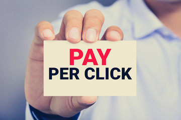 PAY PER CLICK (or PPC) message on the card shown by a man