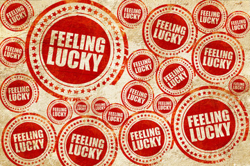 Obraz premium feeling lucky, red stamp on a grunge paper texture