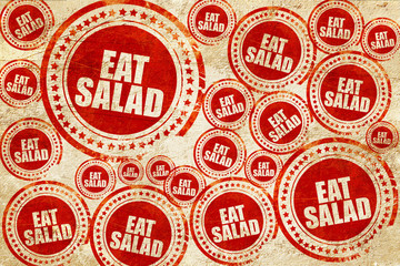 Obraz premium eat salad, red stamp on a grunge paper texture