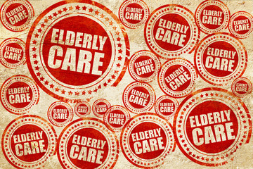 Fototapeta premium elderly care, red stamp on a grunge paper texture