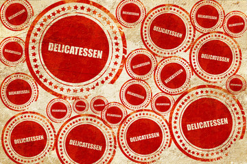 delicatessen, red stamp on a grunge paper texture