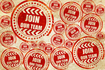 Obraz premium Join our team sign, red stamp on a grunge paper texture