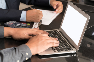 Close up business man use laptop Selective focus on hand.
