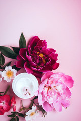 cosmetic creams with pink flowers