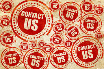 contact us, red stamp on a grunge paper texture
