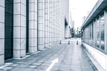 empty road by modern building