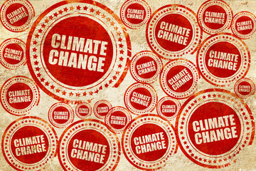 climate change, red stamp on a grunge paper texture