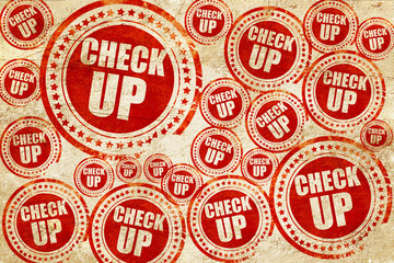 check up, red stamp on a grunge paper texture