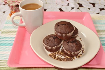 Chocolate muffins and a cup of coffee