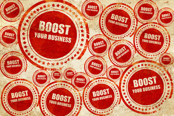 Obraz premium boost your business, red stamp on a grunge paper texture