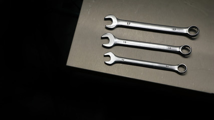 dirty wrenches on grunge background top view with place for text