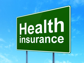 Insurance concept: Health Insurance on road sign background