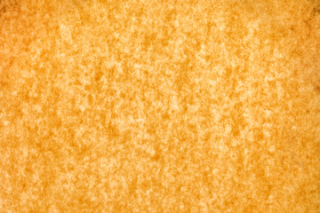 Textured paper background, brown or orange.