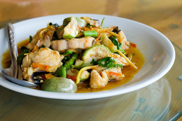 Fried herbal vegetables with fish