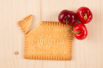 Red cherry on a wooden background flat lay