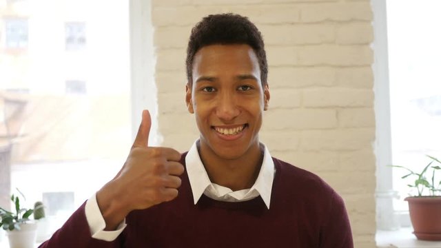 Thumbs Up, Gesture of Success and Achievement by Young Man