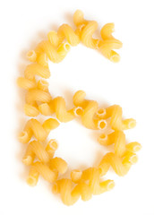 Figure 6 made of macaroni under a daylight isolated on white background