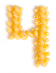 Figure 4 made of macaroni under a daylight isolated on white background - 112593353