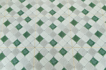 Floor Tile in green and gray background.

