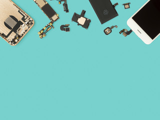 Flat Lay (Top view) of smart phone components isolate on blue background with copy space