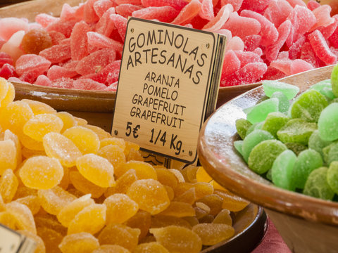 Traditional sweets (gominolas artesanas) made out of dried fruit with sugar for sale on a market stand at Majorca,Spain, Europe - close-up