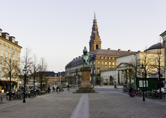 Beautiful old buildings, old castle and statue at nordic street in Copenhagen city center, Denmark.