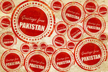 Greetings from pakistan, red stamp on a grunge paper texture
