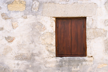 Fototapeta na wymiar Window with brown shutters