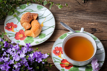 Breakfast with croissants, cup of tea.