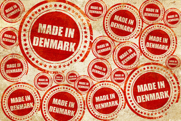 Obraz premium Made in denmark, red stamp on a grunge paper texture