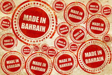 Made in bahrain, red stamp on a grunge paper texture