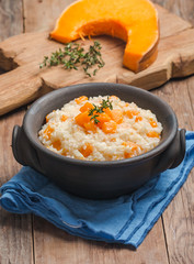 rice with pumpkin in a clay bowl