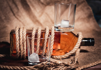 whiskey aged elite alcohol on wooden background