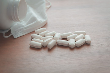 medicine pill on wood table