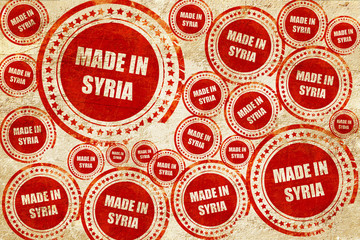 Made in syria, red stamp on a grunge paper texture