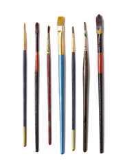 A selection of artists paint brushes isolated on a white background