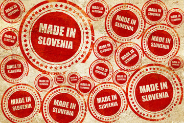 Made in slovenia, red stamp on a grunge paper texture