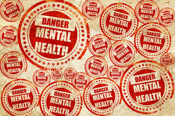 Mental health  sign, red stamp on a grunge paper texture