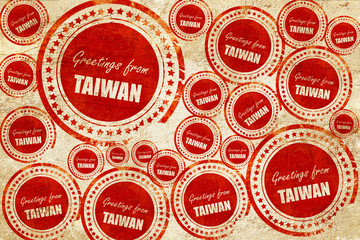 Greetings from taiwan, red stamp on a grunge paper texture