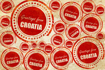 Greetings from croatia, red stamp on a grunge paper texture