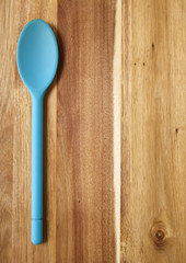 Cooking spoon on a wooden background