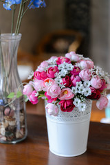 Fake flower on wood table