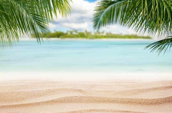 Sandy tropical beach with island on background © Jag_cz