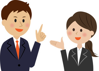 会話するスーツ姿の男女