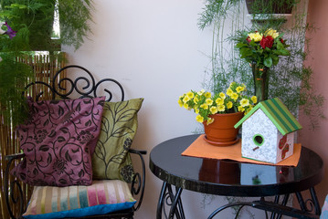 beautiful black furniture on flowery terrace