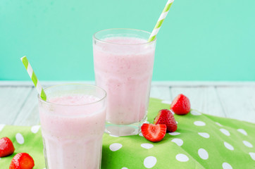 
Summer refreshing cold drink , a milkshake with strawberries on a bright color background