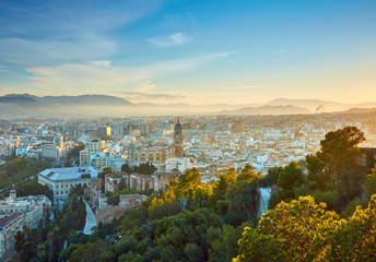 Aerial view of Malaga in sunset lights. Spain - obrazy, fototapety, plakaty