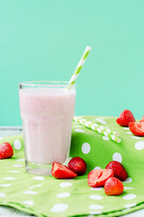 
Summer refreshing cold drink , a milkshake with strawberries on a bright color background