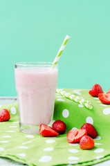 
Summer refreshing cold drink , a milkshake with strawberries on a bright color background