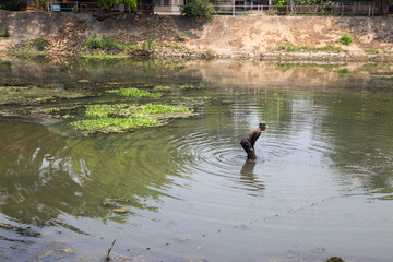 Fisherman in Ping River  in Lampang City Thailand
